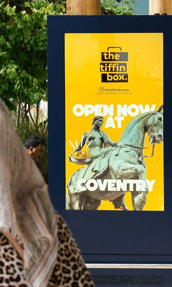 A local takeaway advertised on a digital street screen in Coventry