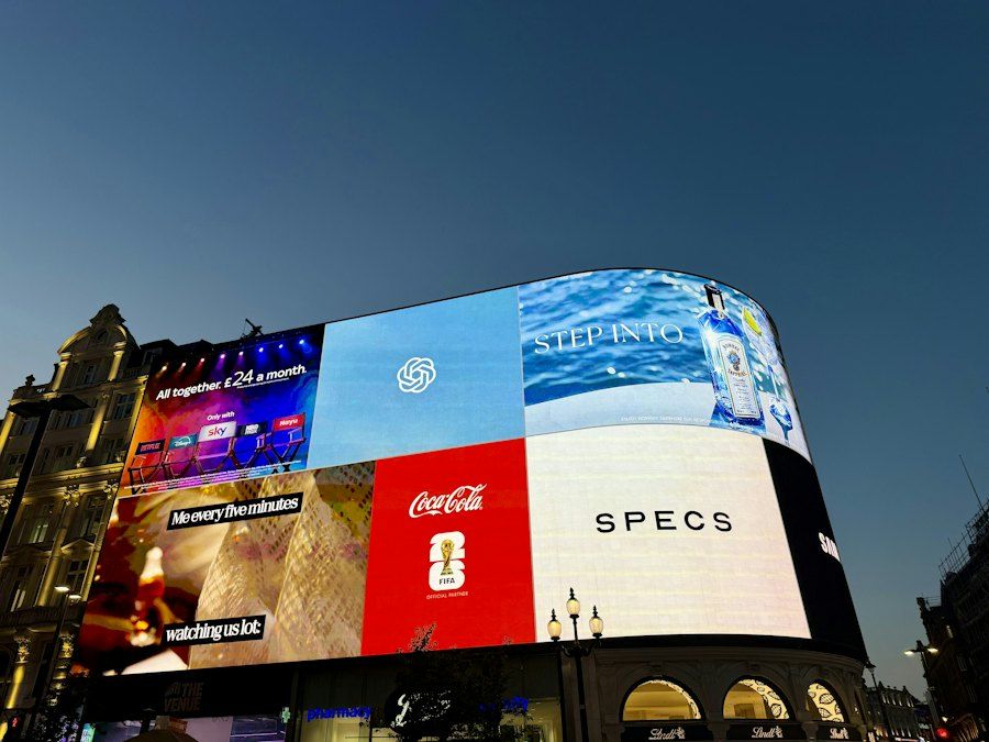 Large illuminated digital billboards at dusk
